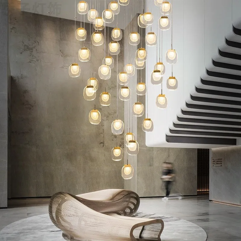 Postmodern crystal chandelier with six gold heads, stainless steel chassis, and adjustable cable on a ceiling