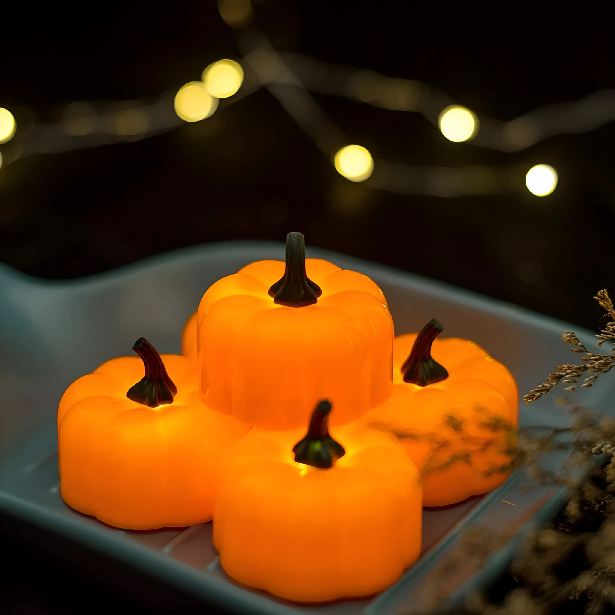 Yellow LED pumpkin light decoration 4.9x4.3 cm on a tabletop for Halloween Christmas party