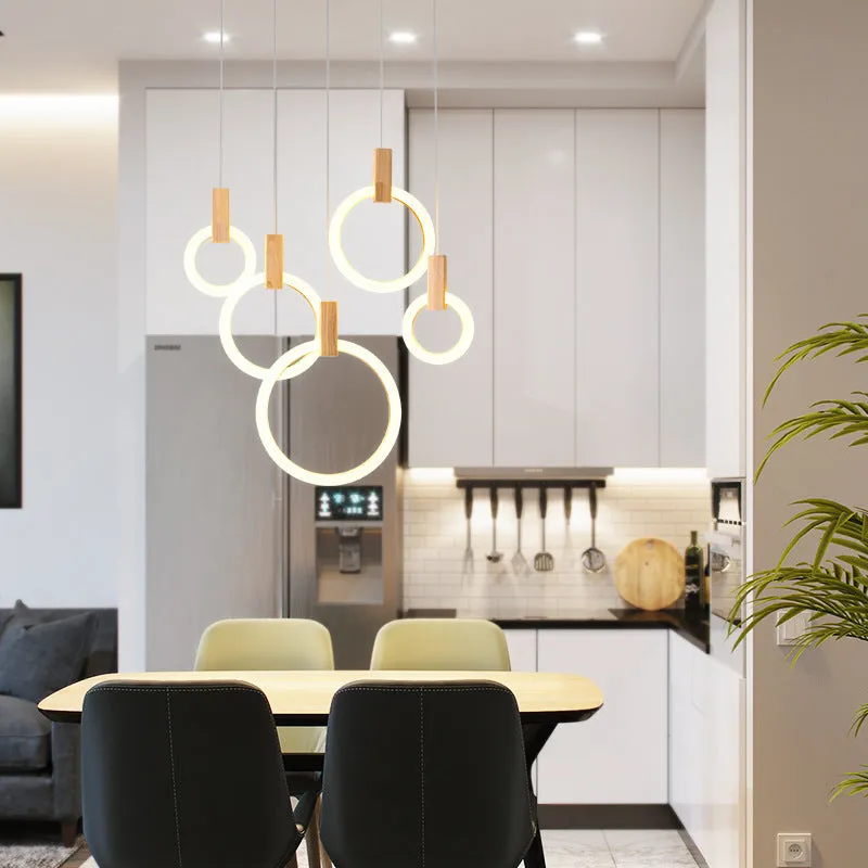 White wooden LED chandelier with three ring sizes 200 300 and 400mm on fishing line suspension for living room