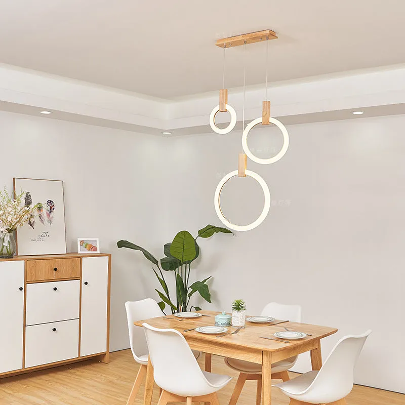 White wooden LED chandelier with three ring sizes 200 300 and 400mm on fishing line suspension for living room