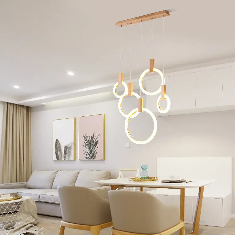 White wooden LED chandelier with three ring sizes 200 300 and 400mm on fishing line suspension for living room