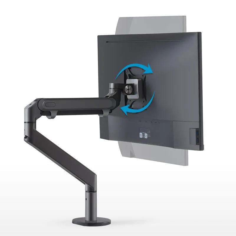 Adjustable lifting computer monitor stand in silver on a desk with a screen placed on top