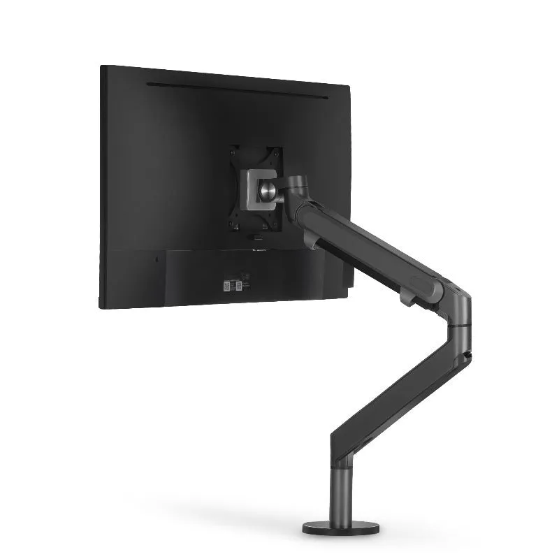 Adjustable lifting computer monitor stand in silver on a desk with a screen placed on top
