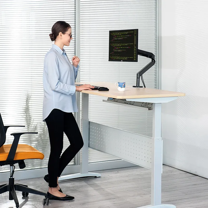 Adjustable lifting computer monitor stand in silver on a desk with a screen placed on top