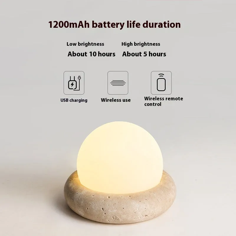 Cream remote control rechargeable bedside lamp with yellow cave stone glow