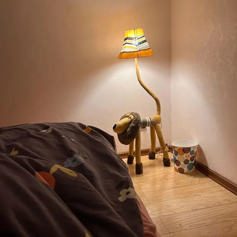 Hand-knitted cloth children's cartoon floor lamp with Christmas deer or lion design in a bedroom setting