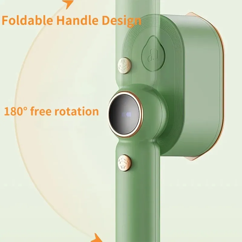 Green household 800W portable garment steamer with foldable handle and titanium plate on plain background