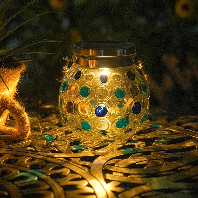 Solar decorative wave point outdoor night light IP65 waterproof in blue colour on a garden table