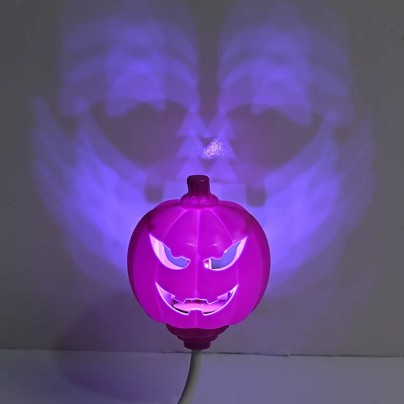 Plastic pumpkin-shaped decorative lamp with USB cable, showing yellow or purple LED light option.