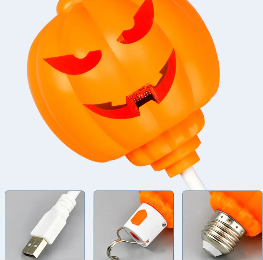 Plastic pumpkin-shaped decorative lamp with USB cable, showing yellow or purple LED light option.