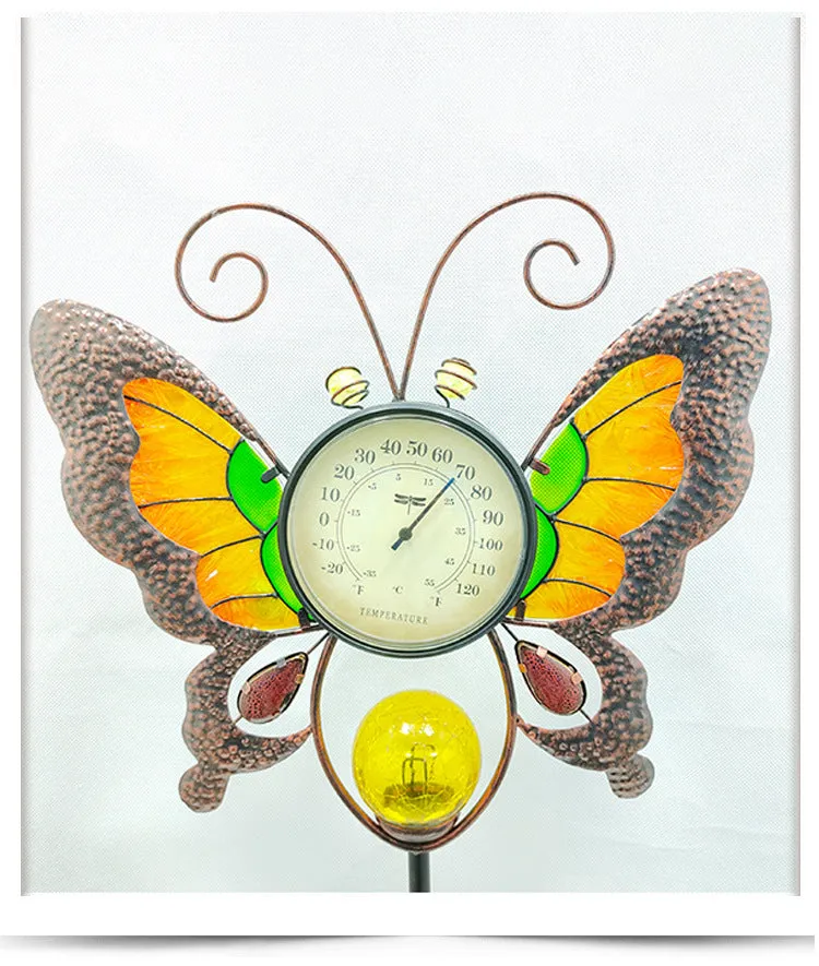 Solar garden thermometer butterfly stake measuring 30x6x110cm inserted in lawn