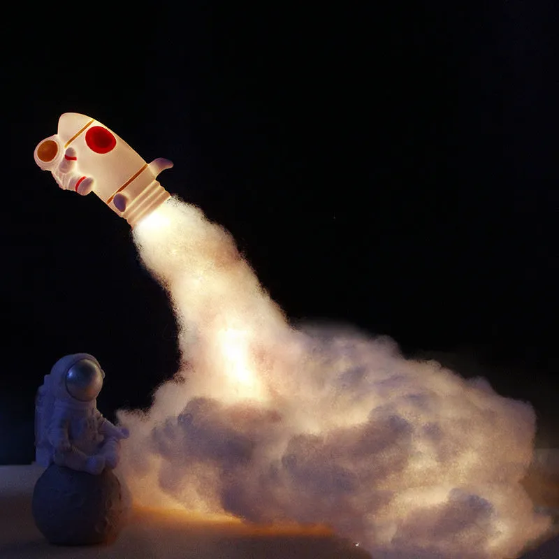 DIY astronaut rocket LED night light kit components including model, straws, chassis, and string lights for assembly