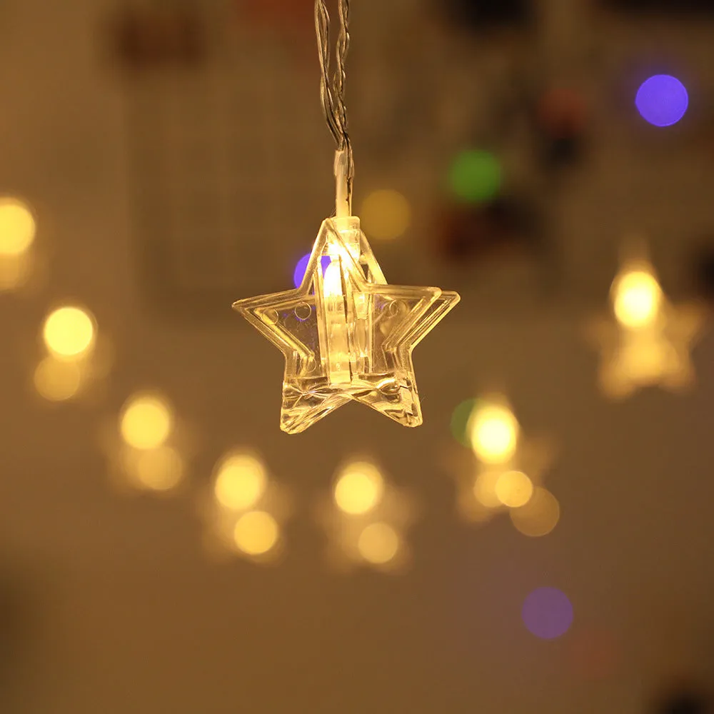 LED star clip festoon lights on a dark background showing warm white 3-metre string with 20 star-shaped lamps