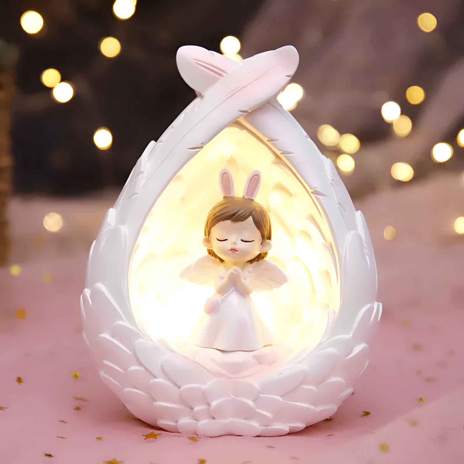 Angel wings star light made of synthetic resin with star and wing design, available in prayer or love style options