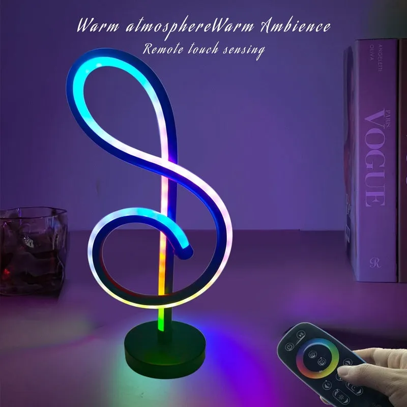 Black musical note shaped Bluetooth LED night light with remote control on a bedside table.