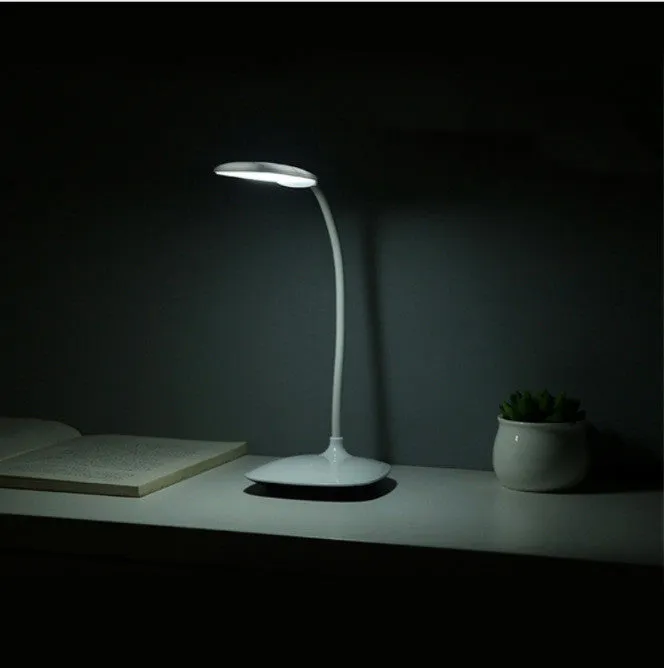 White LED desk lamp with touch control and USB charging on a wooden desk, showing compact 385x120x100mm size