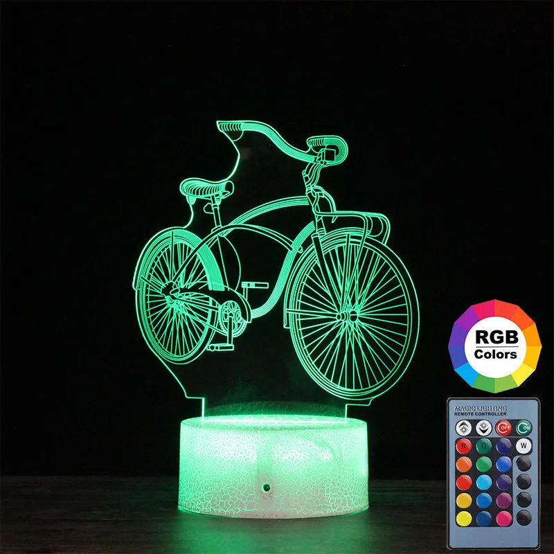 3D bicycle night light with LED acrylic shade on black base against a dark background