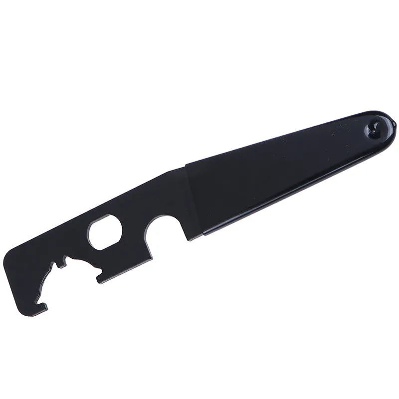 Black steel and rubber multi-function tactical wrench on dark surface showing slim 20.8cm profile