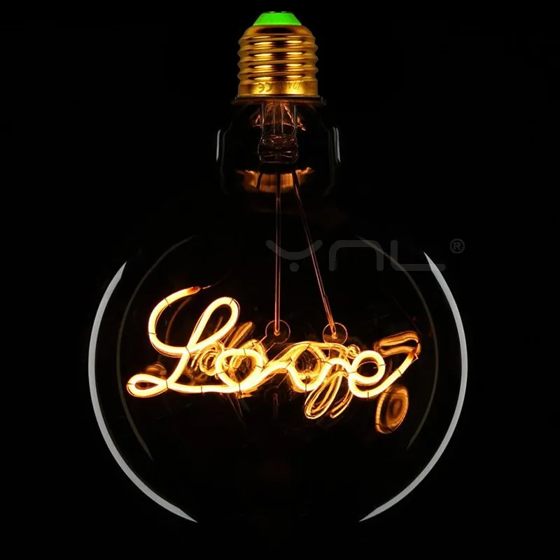 Yellow LOVE letter lamp with glass lampshade emitting warm light, 125x175mm on a tabletop