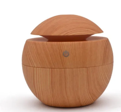 USB ultrasonic atomizer with colourful light and 130ml water tank in white colour option on a wooden desk