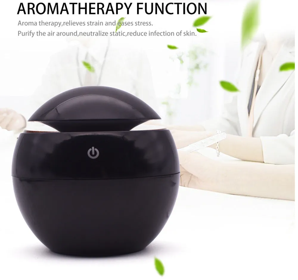 USB ultrasonic atomizer with colourful light and 130ml water tank in white colour option on a wooden desk