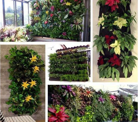 Green felt vertical wall garden planter with multiple planting pockets hung on an outdoor fence.