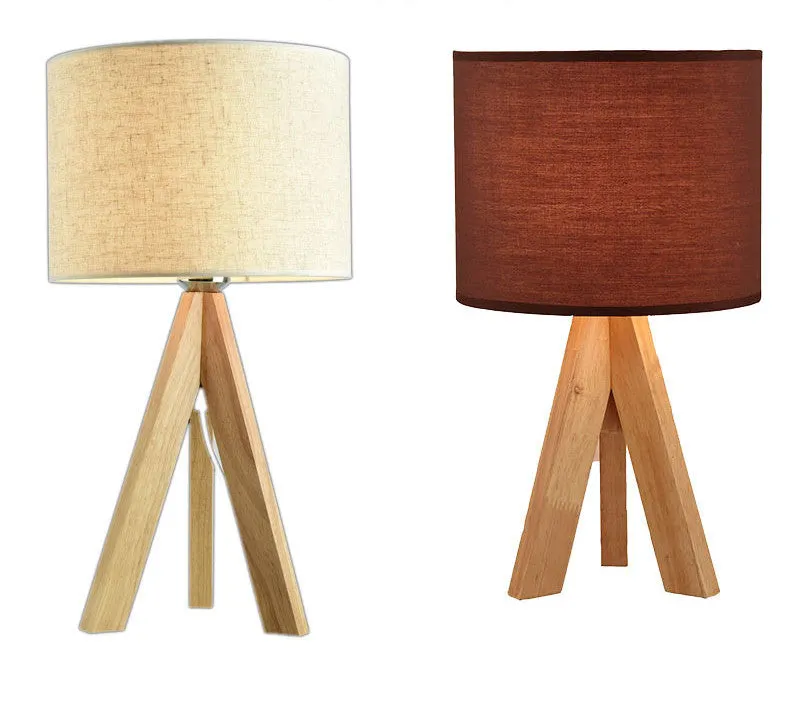 Japanese style solid wood table lamp with fabric lampshade in linen trumpet colour on bedside table