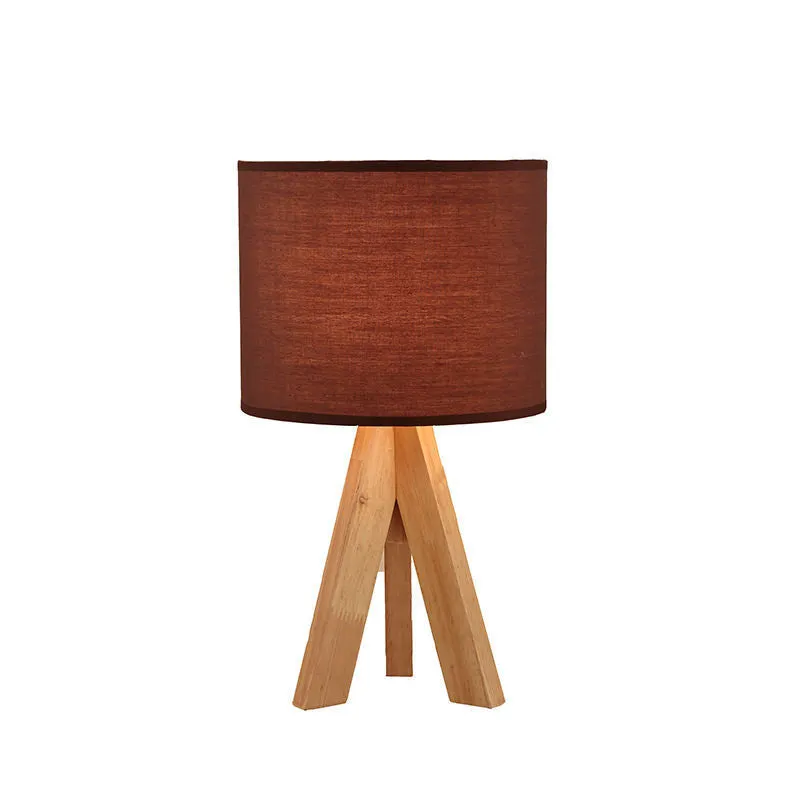 Japanese style solid wood table lamp with fabric lampshade in linen trumpet colour on bedside table