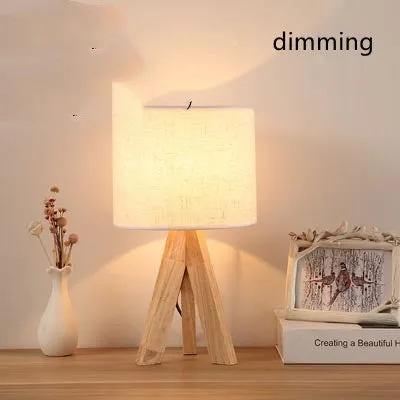 Japanese style solid wood table lamp with fabric lampshade in linen trumpet colour on bedside table