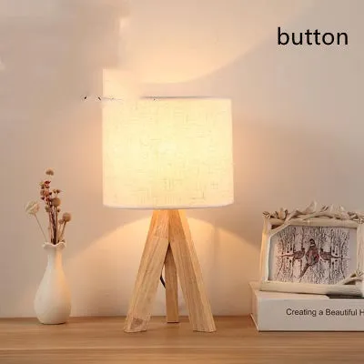 Japanese style solid wood table lamp with fabric lampshade in linen trumpet colour on bedside table