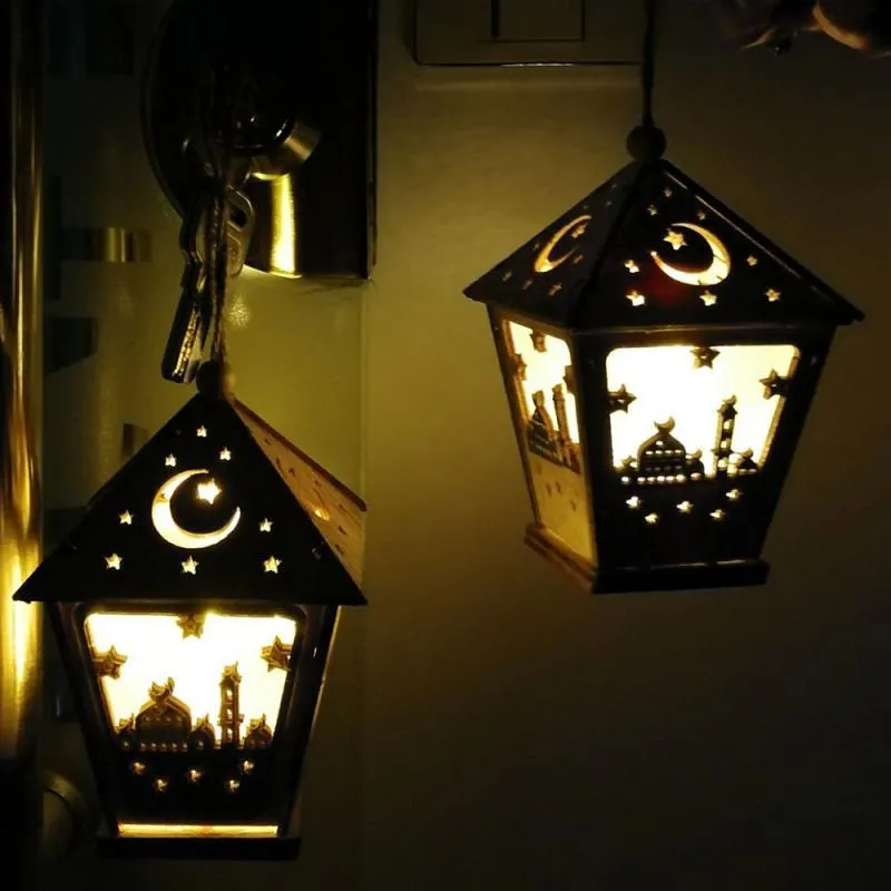 Three-dimensional carved boxwood house pendant with LED lights in blue colour option