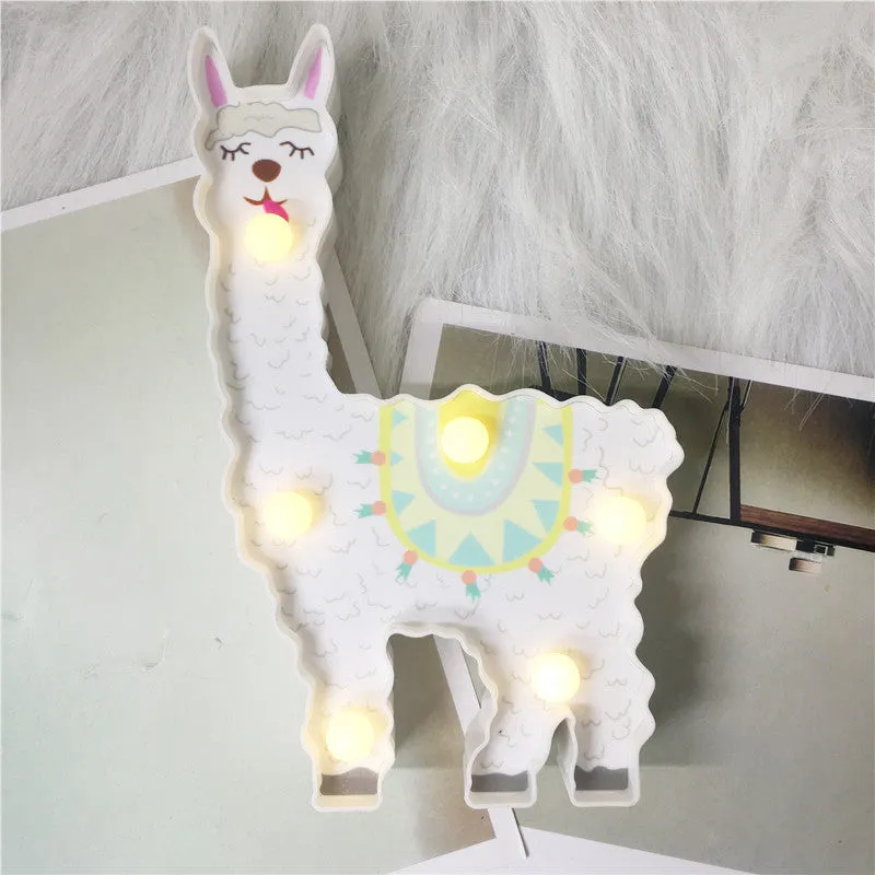 Alpaca night light 19cm tall in white colour on bedside table