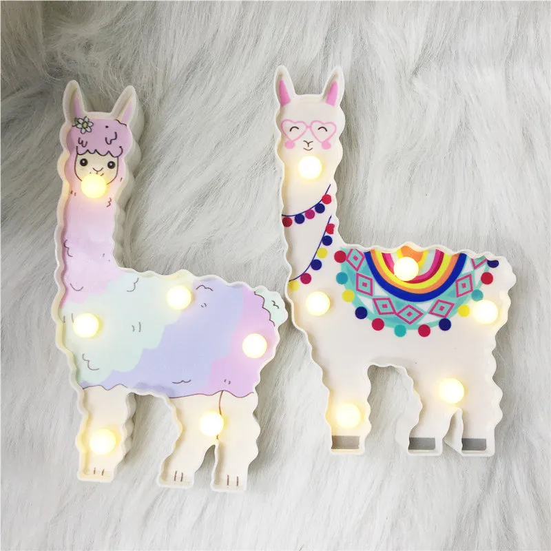 Alpaca night light 19cm tall in white colour on bedside table