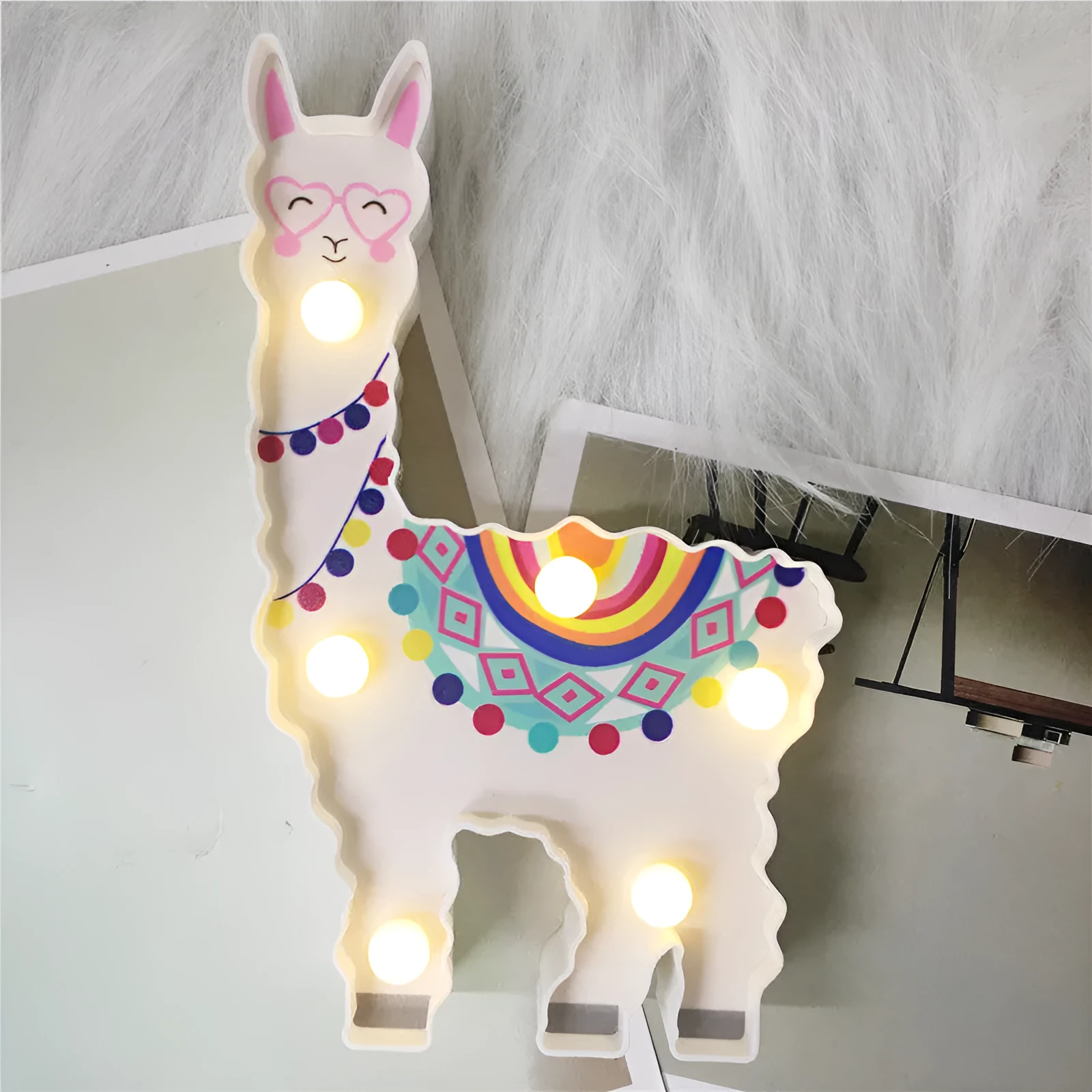 Alpaca night light 19cm tall in white colour on bedside table