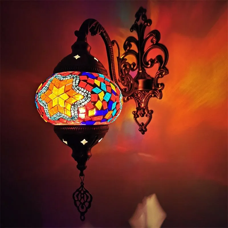 Bohemian iron wall lamp with bronze electroplated finish and primary colour glass shade, measuring 14cm diameter and 40cm height
