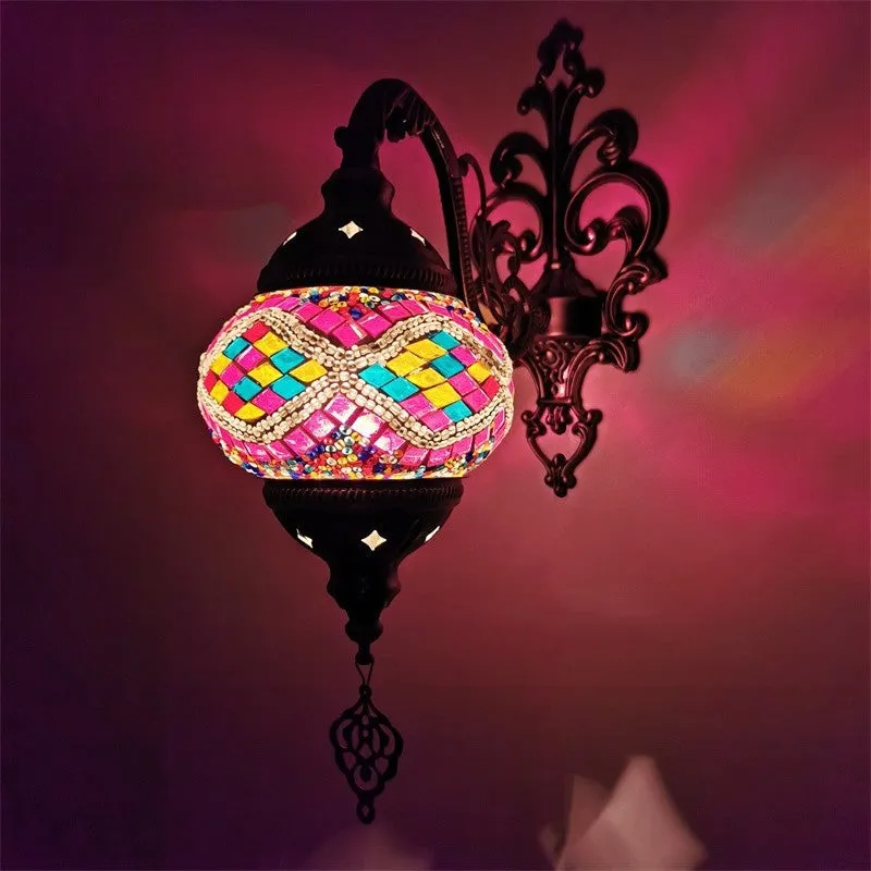 Bohemian iron wall lamp with bronze electroplated finish and primary colour glass shade, measuring 14cm diameter and 40cm height