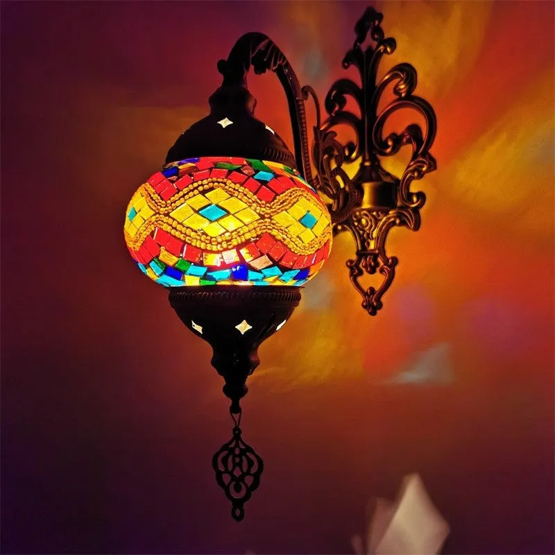 Bohemian iron wall lamp with bronze electroplated finish and primary colour glass shade, measuring 14cm diameter and 40cm height