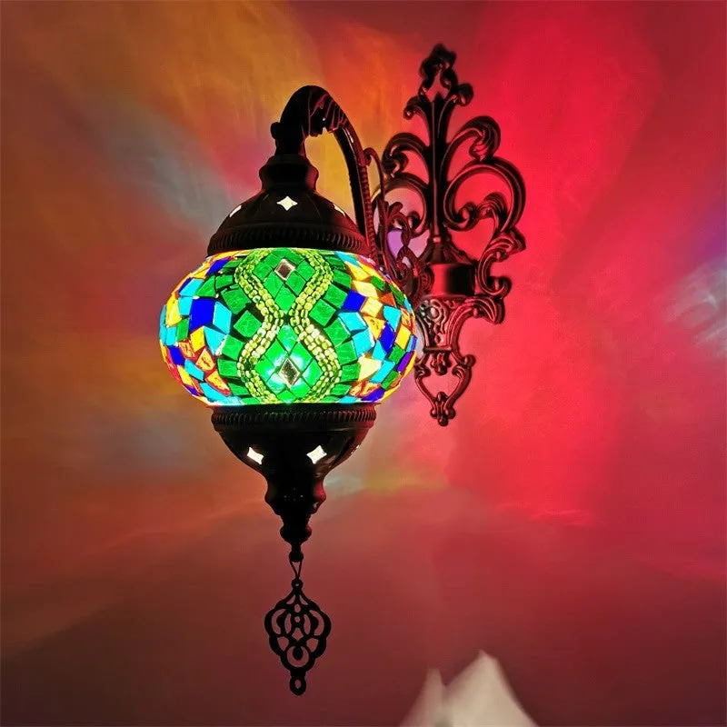 Bohemian iron wall lamp with bronze electroplated finish and primary colour glass shade, measuring 14cm diameter and 40cm height
