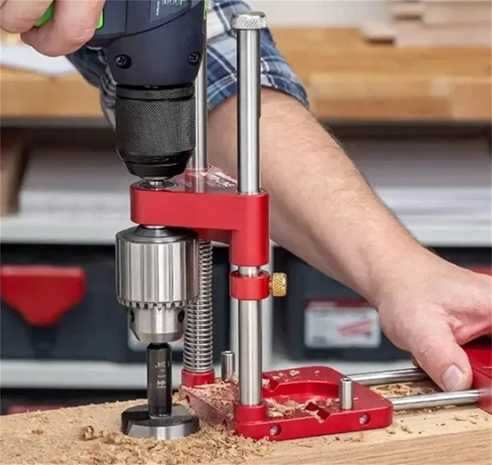 Red alloy steel woodworking drill locator on wood surface with plastic components