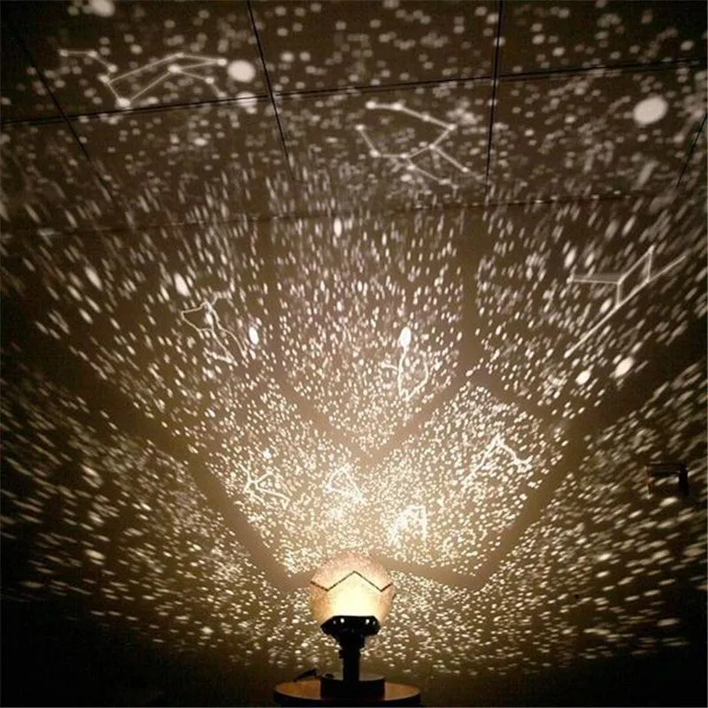 LED starry sky projector night lamp showing constellation projections on a bedroom ceiling with remote control