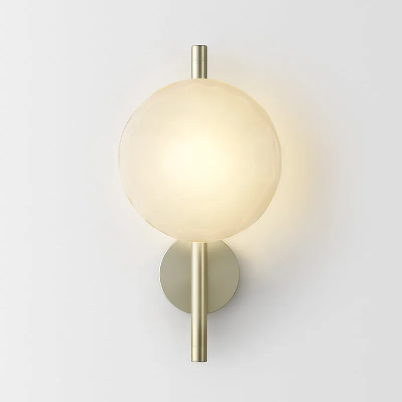 Bedside hotel glass art wall lamp with transparent lampshade and iron body on a wall
