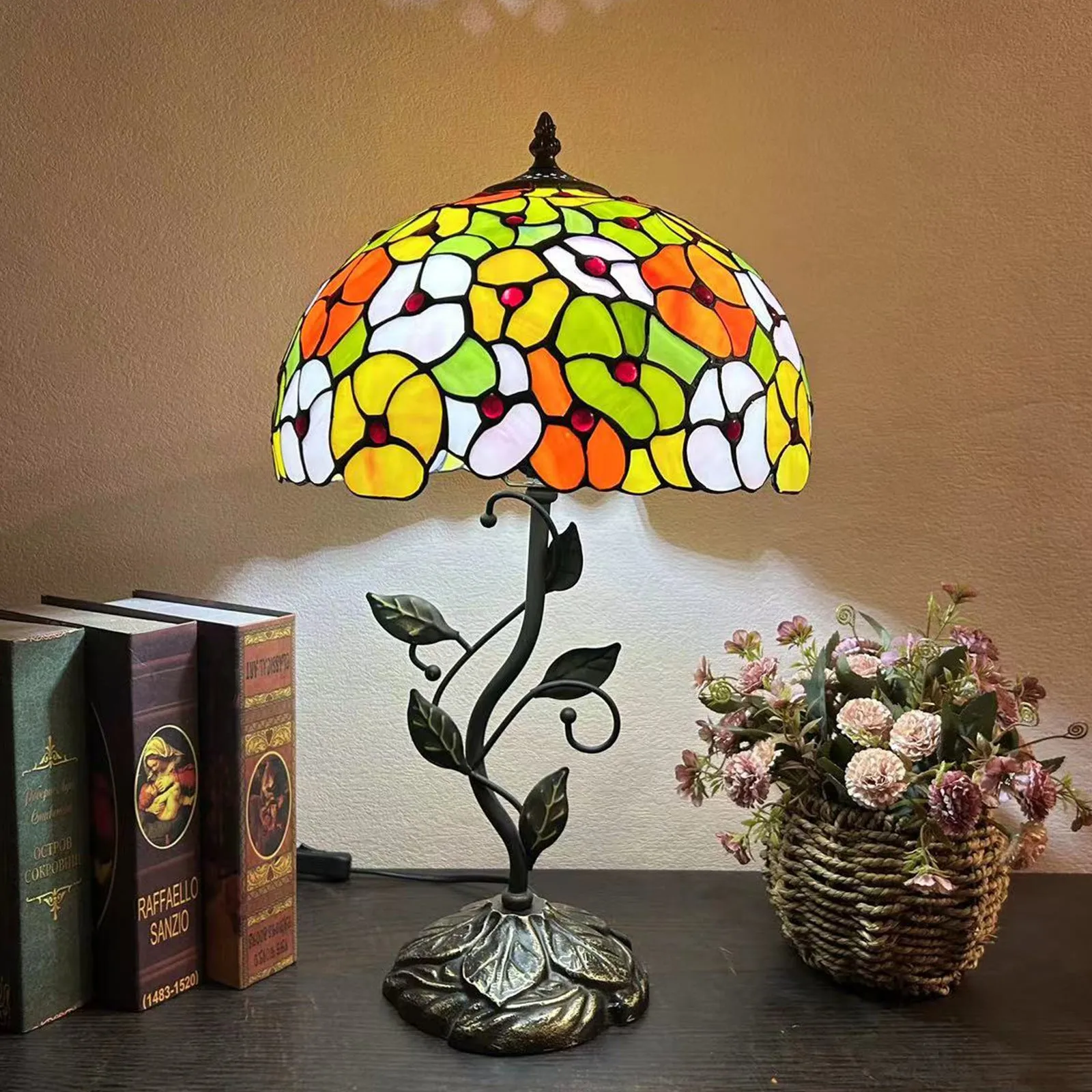 American Pastoral Tiffany 12-inch table lamp with coloured glass shade and resin base, 30 cm wide