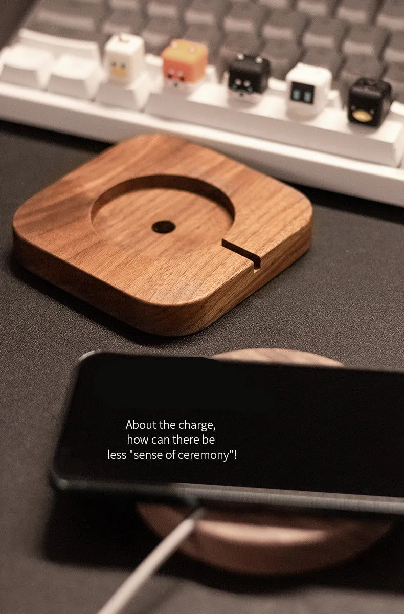 Walnut wood magnetic wireless charging bracket base on desk with phone