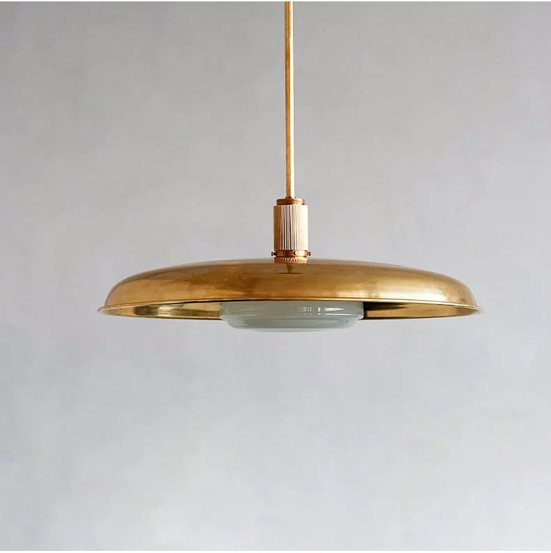 American retro alloy ceiling lamp in copper finish mounted on a ceiling.