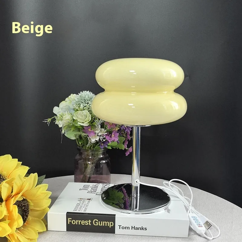 Desktop small table lamp with glass lampshade and USB plug-in tri-colour lighting on a wooden desk