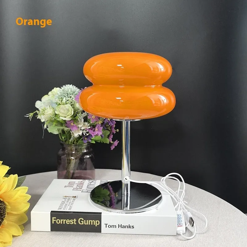 Desktop small table lamp with glass lampshade and USB plug-in tri-colour lighting on a wooden desk