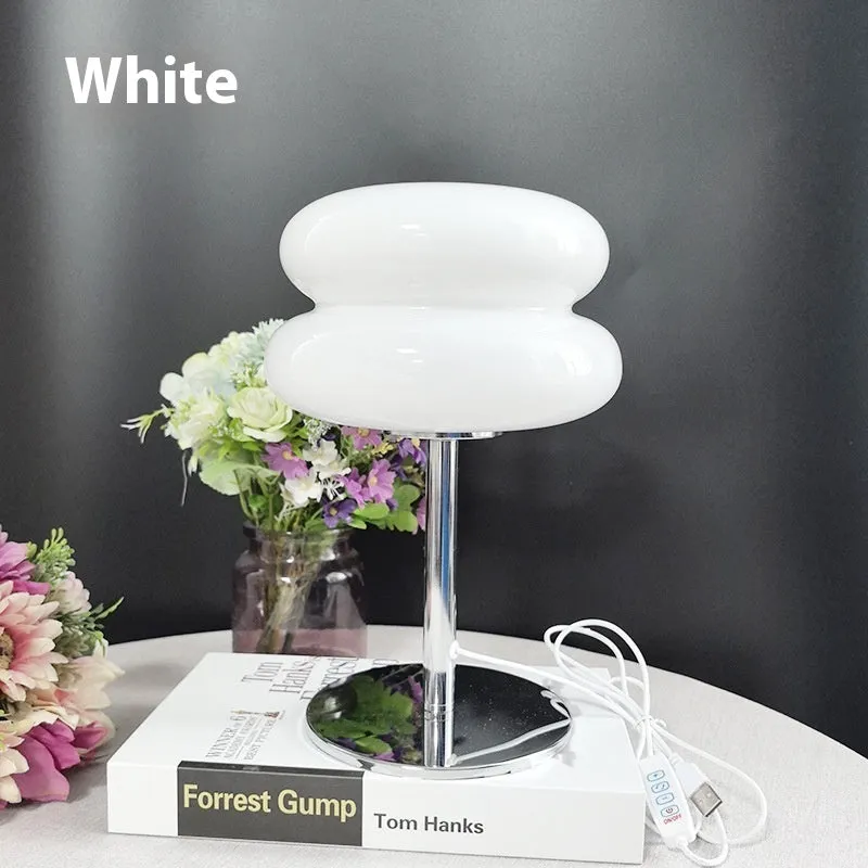 Desktop small table lamp with glass lampshade and USB plug-in tri-colour lighting on a wooden desk