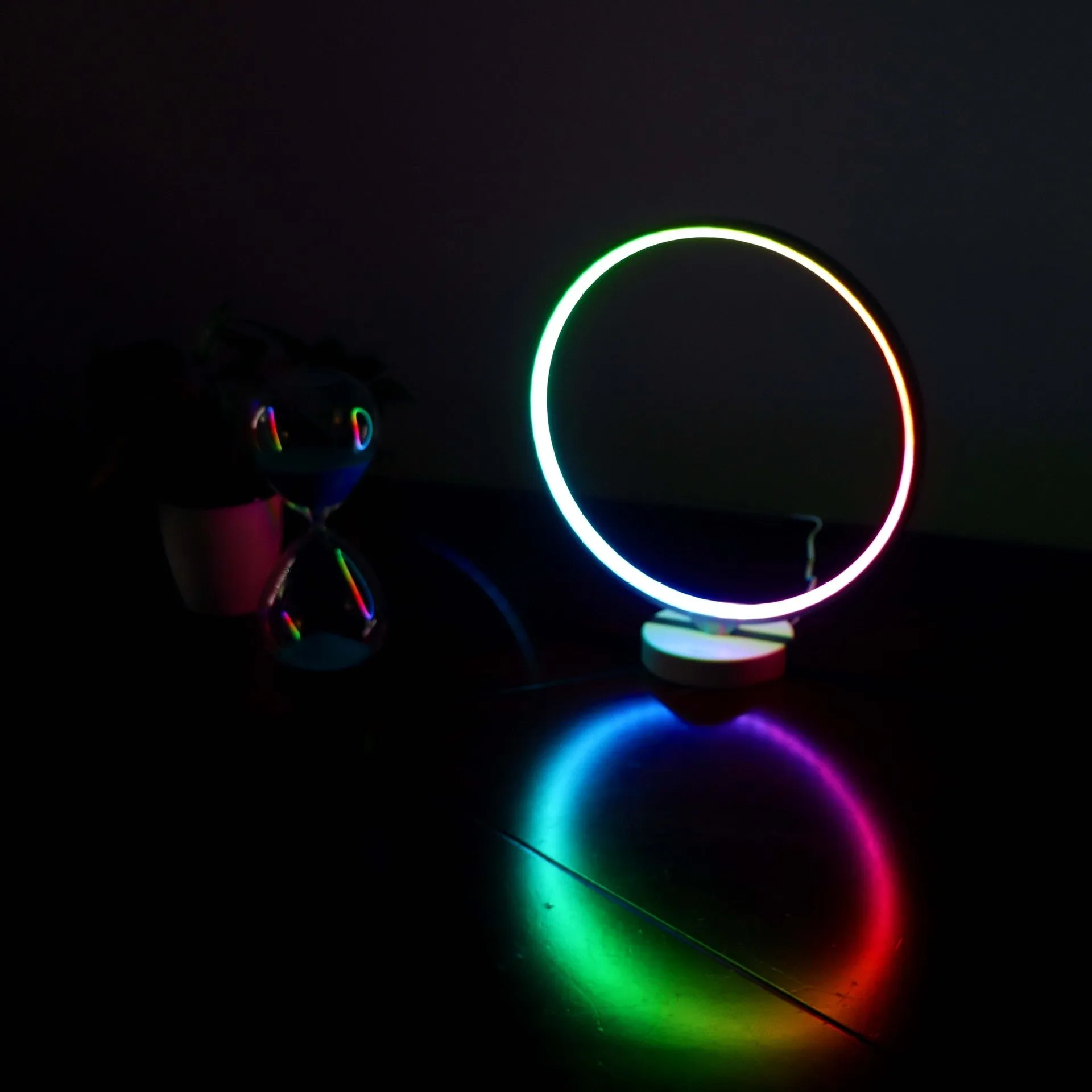White full moon mood lamp with remote control on table showing warm white and RGB lighting options