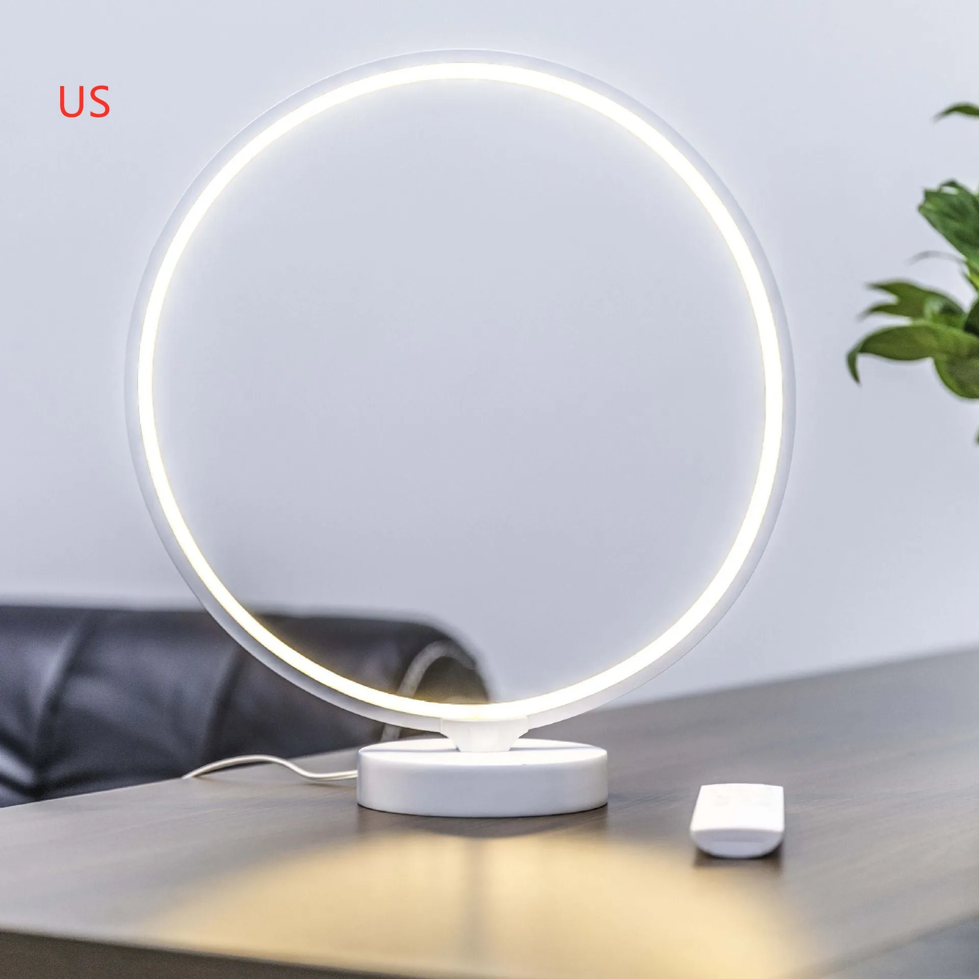 White full moon mood lamp with remote control on table showing warm white and RGB lighting options