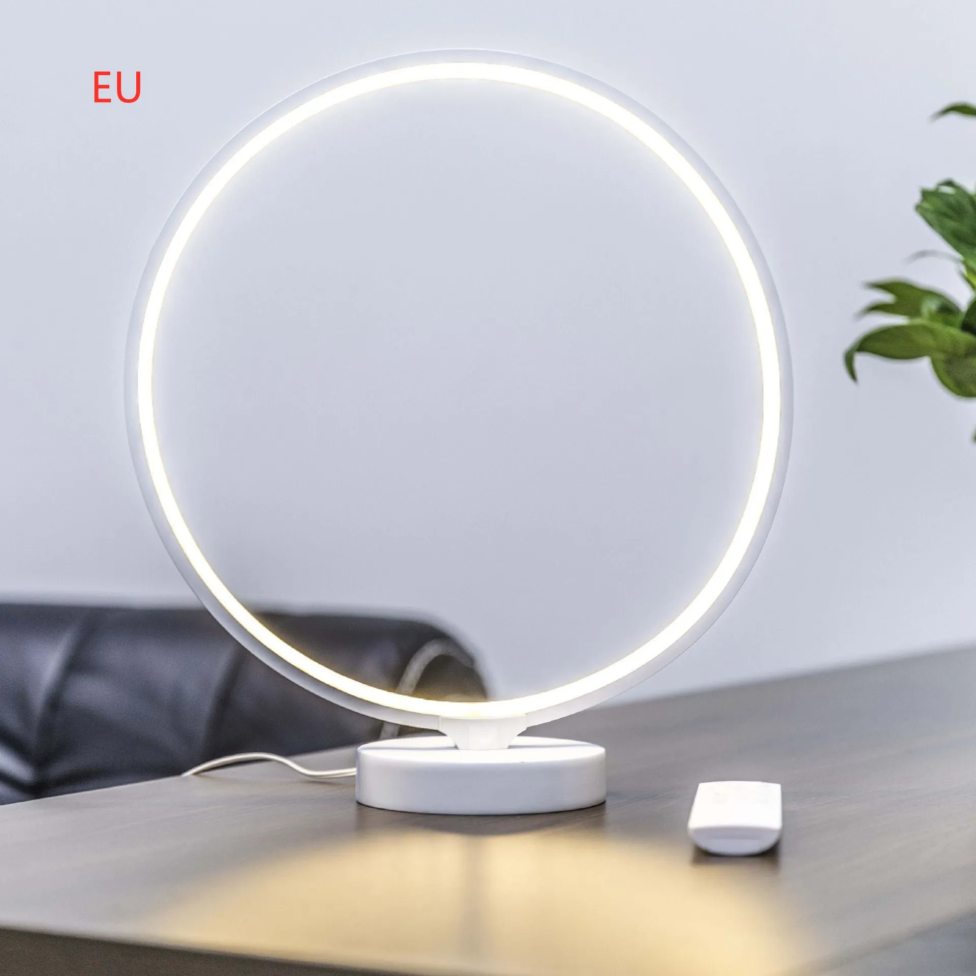 White full moon mood lamp with remote control on table showing warm white and RGB lighting options